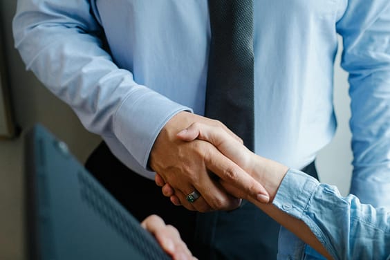 pexels-photo-5668834-5668834 High angle of crop unrecognizable male and female business partners in formal clothes shaking hands after successful deal